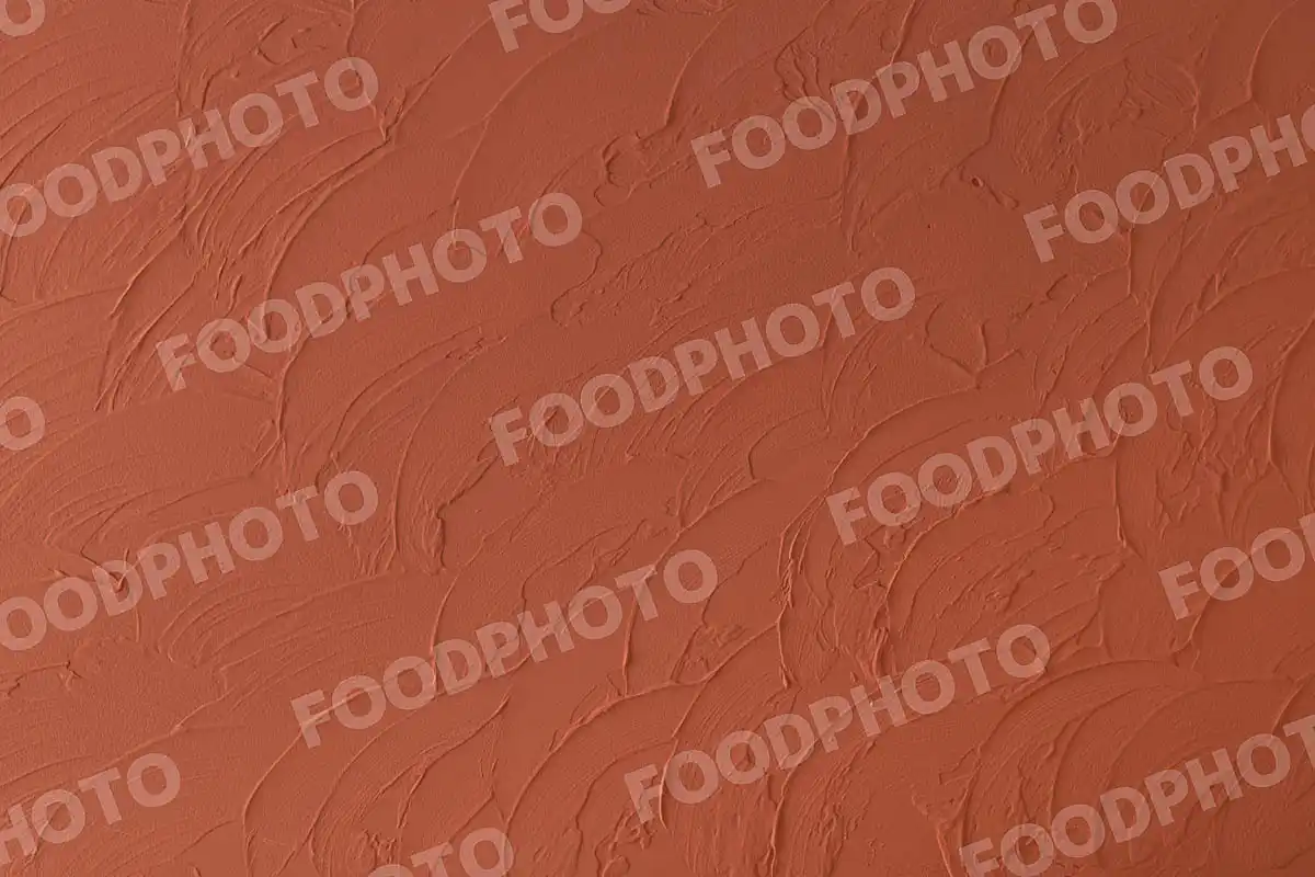 煉瓦色の漆喰壁。